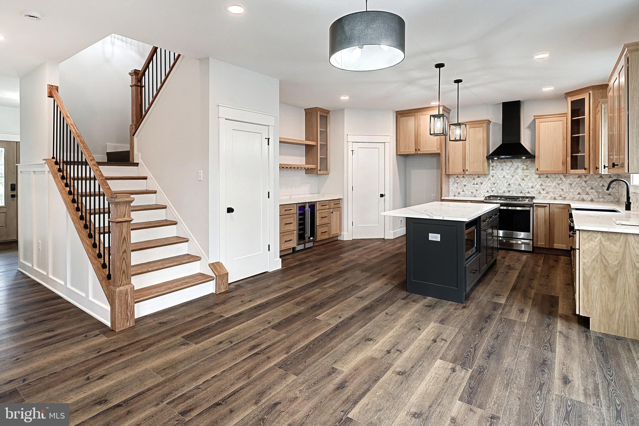 0 Sawmill Road Stewartstown, PA 17363 - Photo 4 of 37 a large kitchen with stainless steel appliances granite countertop a lot of counter space and wooden floors