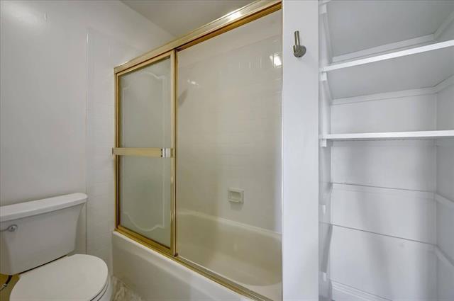262 Beachview Avenue, Unit 5 Pacifica, CA 94044 - Photo 15 of 23 a bathroom with a shower and a toilet