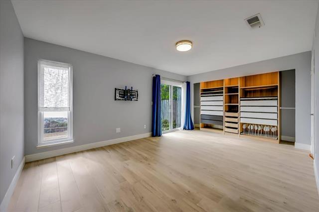262 Beachview Avenue, Unit 5 Pacifica, CA 94044 - Photo 16 of 23 a view of an empty room with wooden floor and a window