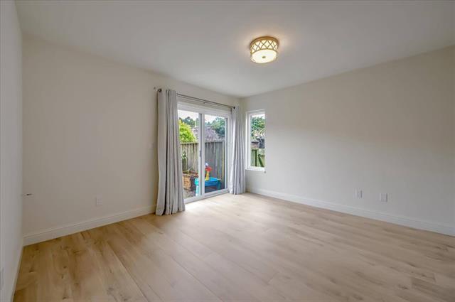 262 Beachview Avenue, Unit 5 Pacifica, CA 94044 - Photo 18 of 23 an empty room with windows