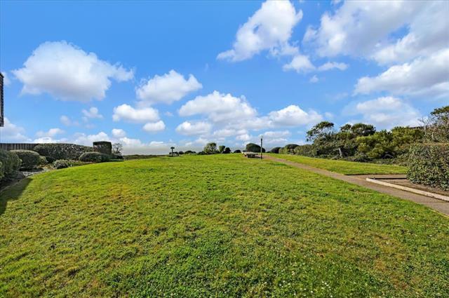 262 Beachview Avenue, Unit 5 Pacifica, CA 94044 - Photo 21 of 23 a view of a golf course with green space