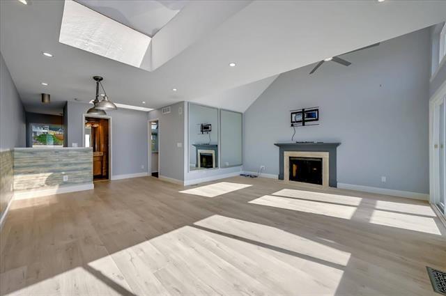 262 Beachview Avenue, Unit 5 Pacifica, CA 94044 - Photo 6 of 23 a view of an empty room with a fireplace