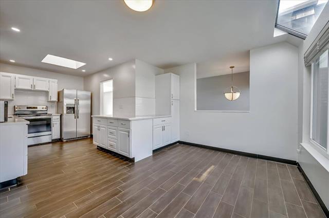 262 Beachview Avenue, Unit 5 Pacifica, CA 94044 - Photo 9 of 23 a view of kitchen with furniture and wooden floor