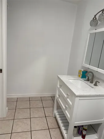 a bathroom with a sink a vanity and a mirror