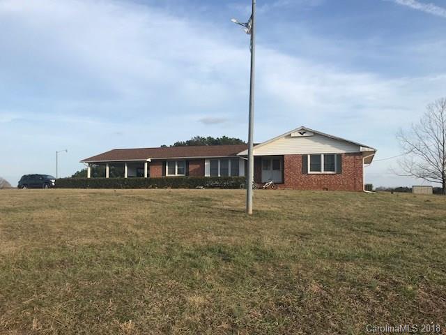299 Abrams Moore Road Rutherfordton, NC 28139 - Photo 1 of 14 a front view of a house with a garden