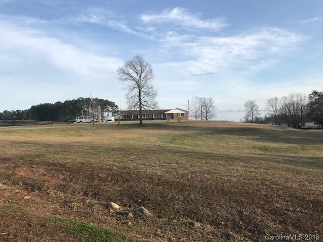 299 Abrams Moore Road Rutherfordton, NC 28139 - Photo 8 of 14 a view of a lake with houses in the background