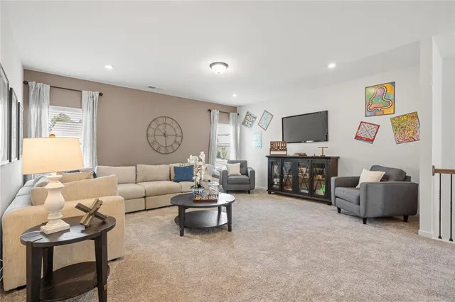 a living room with furniture and a table