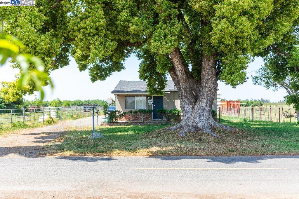 437 Goodwin Road Modesto, CA 95357 - Photo 1 of 1 a front view of a house with garden
