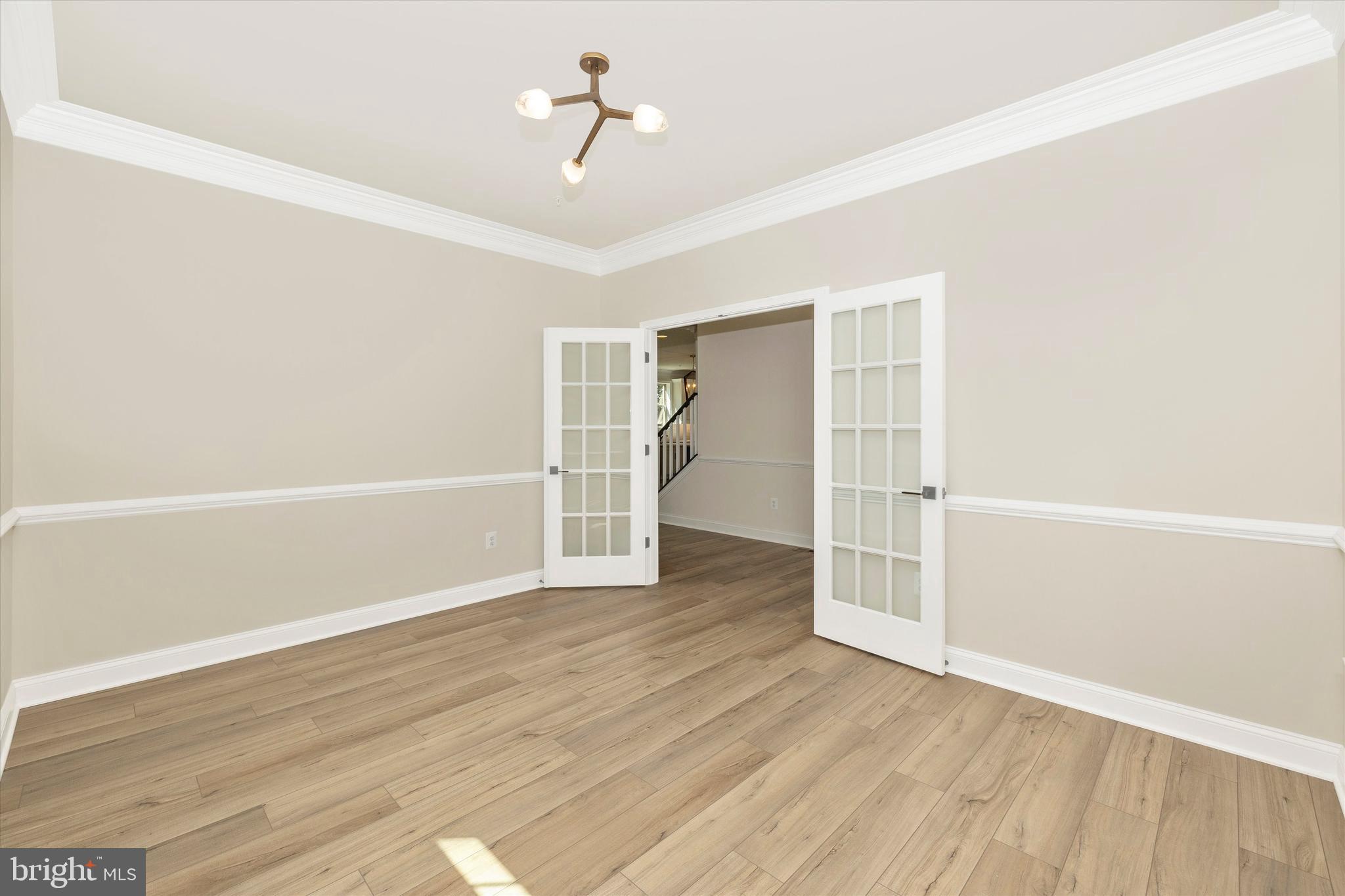 391 Masters Road New Market, MD 21774 - Photo 14 of 71 a view of empty room with wooden floor and ceiling fan