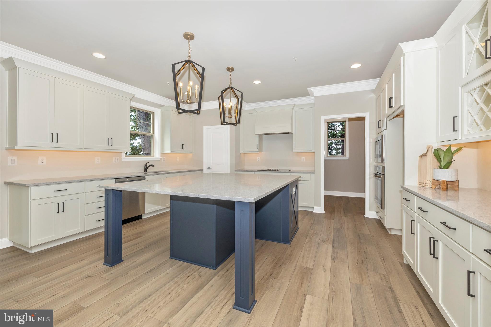 391 Masters Road New Market, MD 21774 - Photo 21 of 71 a kitchen with a sink cabinets and wooden floor