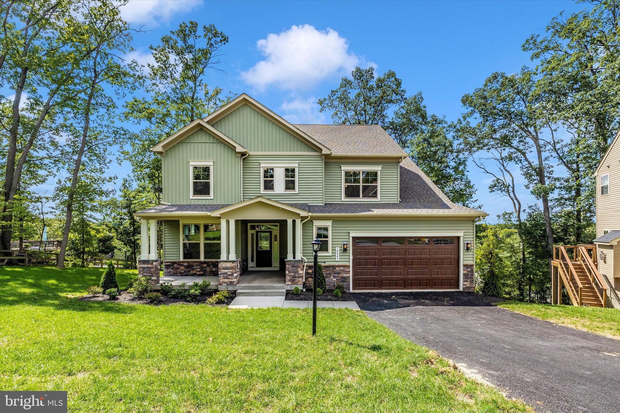 391 Masters Road New Market, MD 21774 - Photo 4 of 71 a front view of a house with a yard and trees