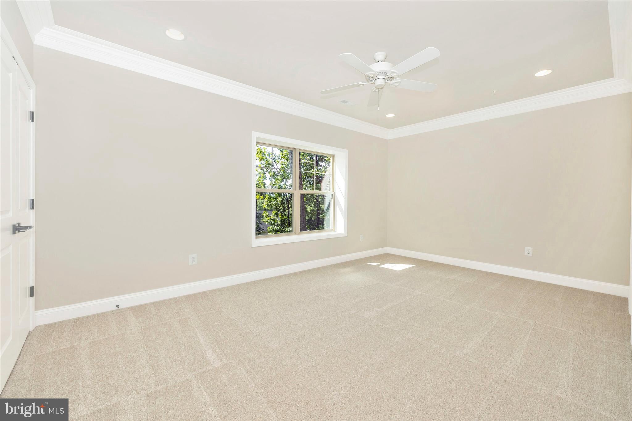 391 Masters Road New Market, MD 21774 - Photo 57 of 71 an empty room with a window and a ceiling fan