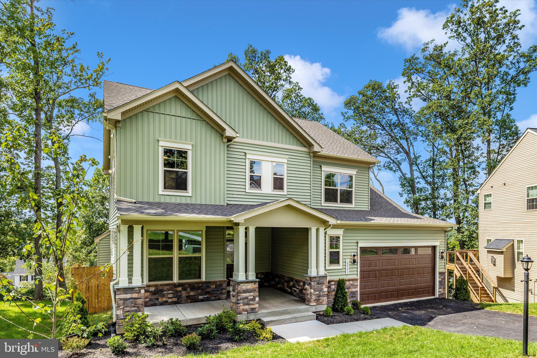 391 Masters Road New Market, MD 21774 - Photo 6 of 71 a front view of a house with a yard and garage