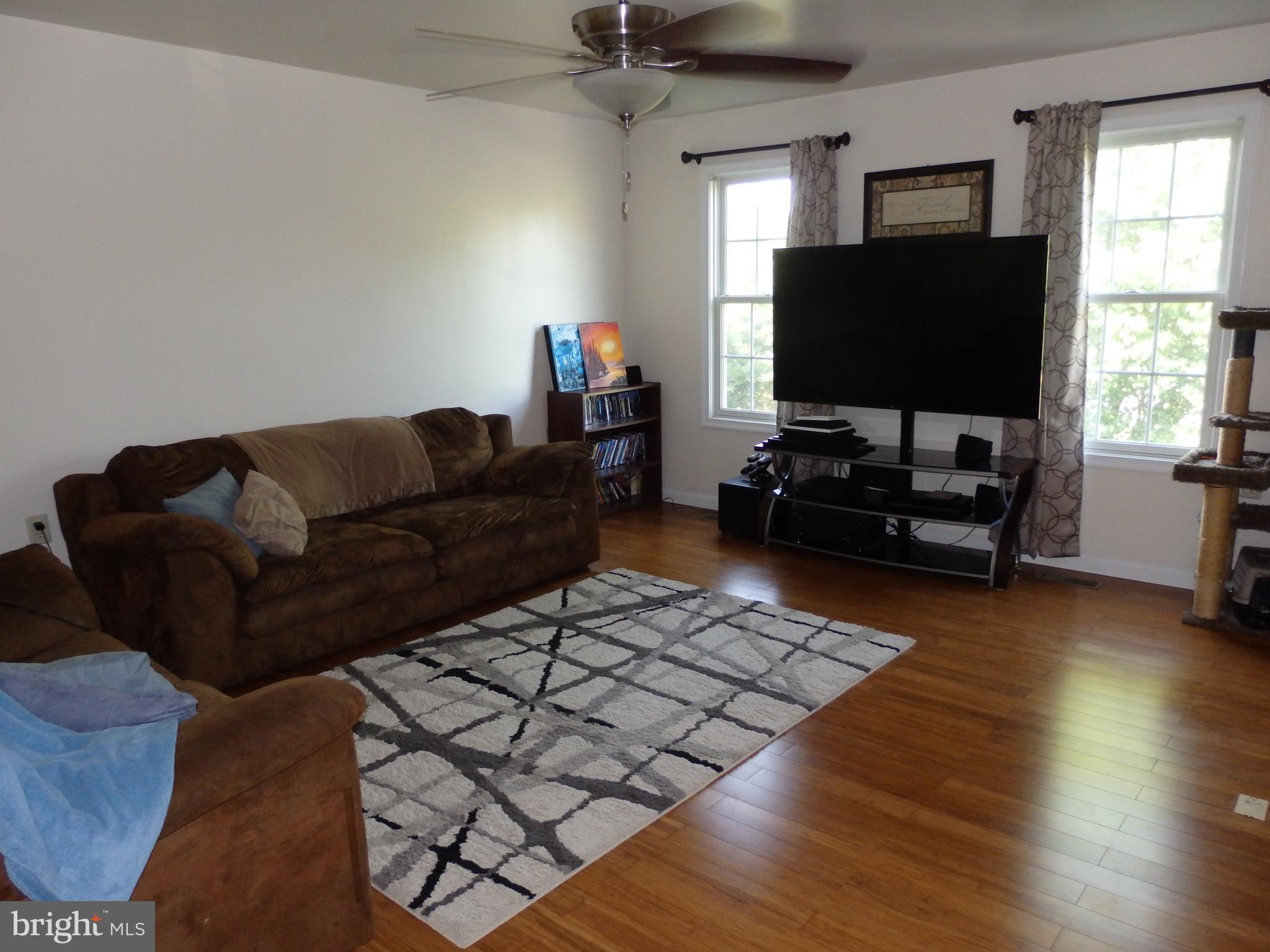 1838 Frank Road Chambersburg, PA 17202 - Photo 3 of 17 Sunny room with gleaming hardwood floors