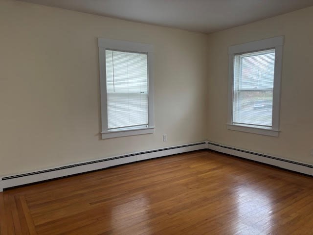 9 Windsor Avenue, Unit 9A Acton, MA 01720 - Photo 2 of 10 an empty room with wooden floor and windows