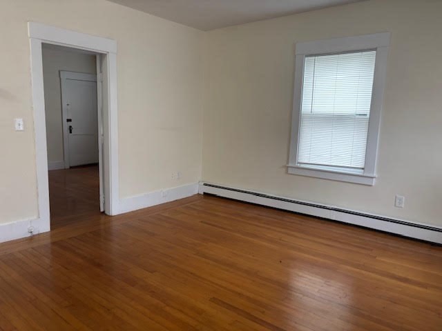 9 Windsor Avenue, Unit 9A Acton, MA 01720 - Photo 3 of 10 an empty room with wooden floor and windows