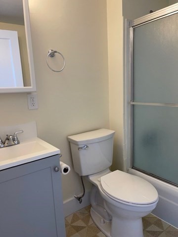 9 Windsor Avenue, Unit 9A Acton, MA 01720 - Photo 8 of 10 a white toilet sitting next to a bathroom sink