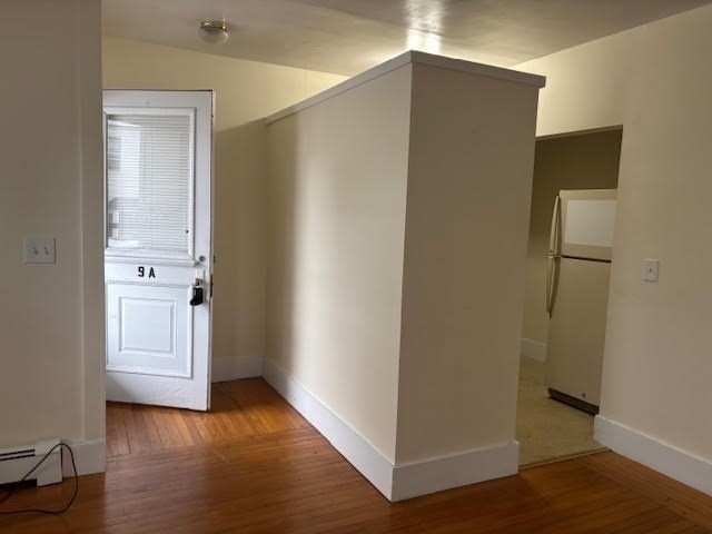 9 Windsor Avenue, Unit 9A Acton, MA 01720 - Photo 9 of 10 a view of empty room with wooden floor