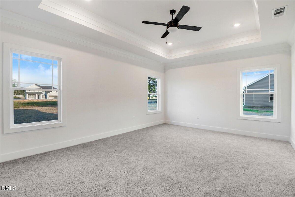 254 Galway Road Lillington, NC 27546 - Photo 18 of 35 an empty room with a empty space and windows