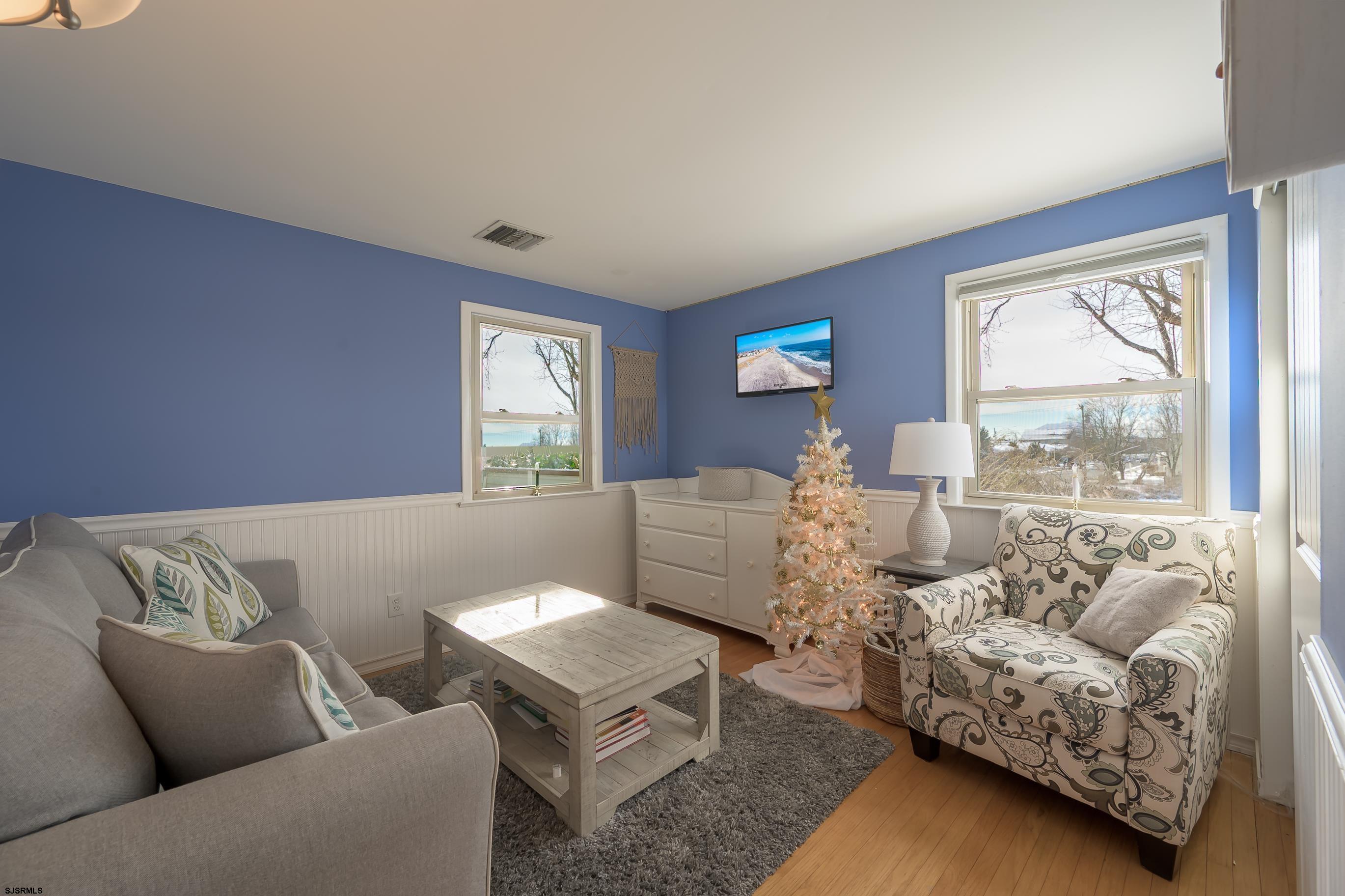 1 Exeter Court Margate City, NJ 08402 - Photo 11 of 25 a living room with furniture and a window