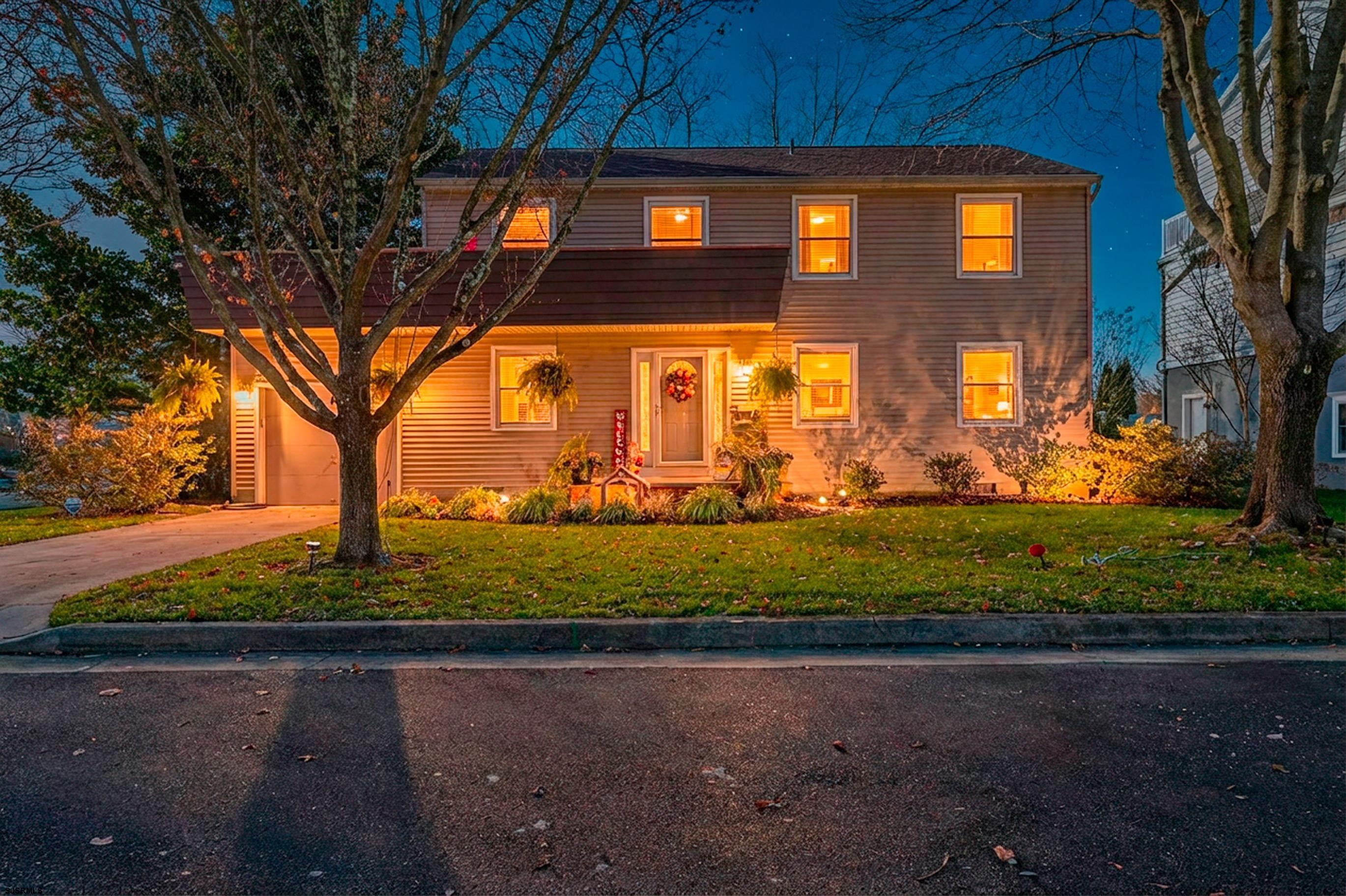 1 Exeter Court Margate City, NJ 08402 - Photo 17 of 25 a view of a yard in front of a house with large trees