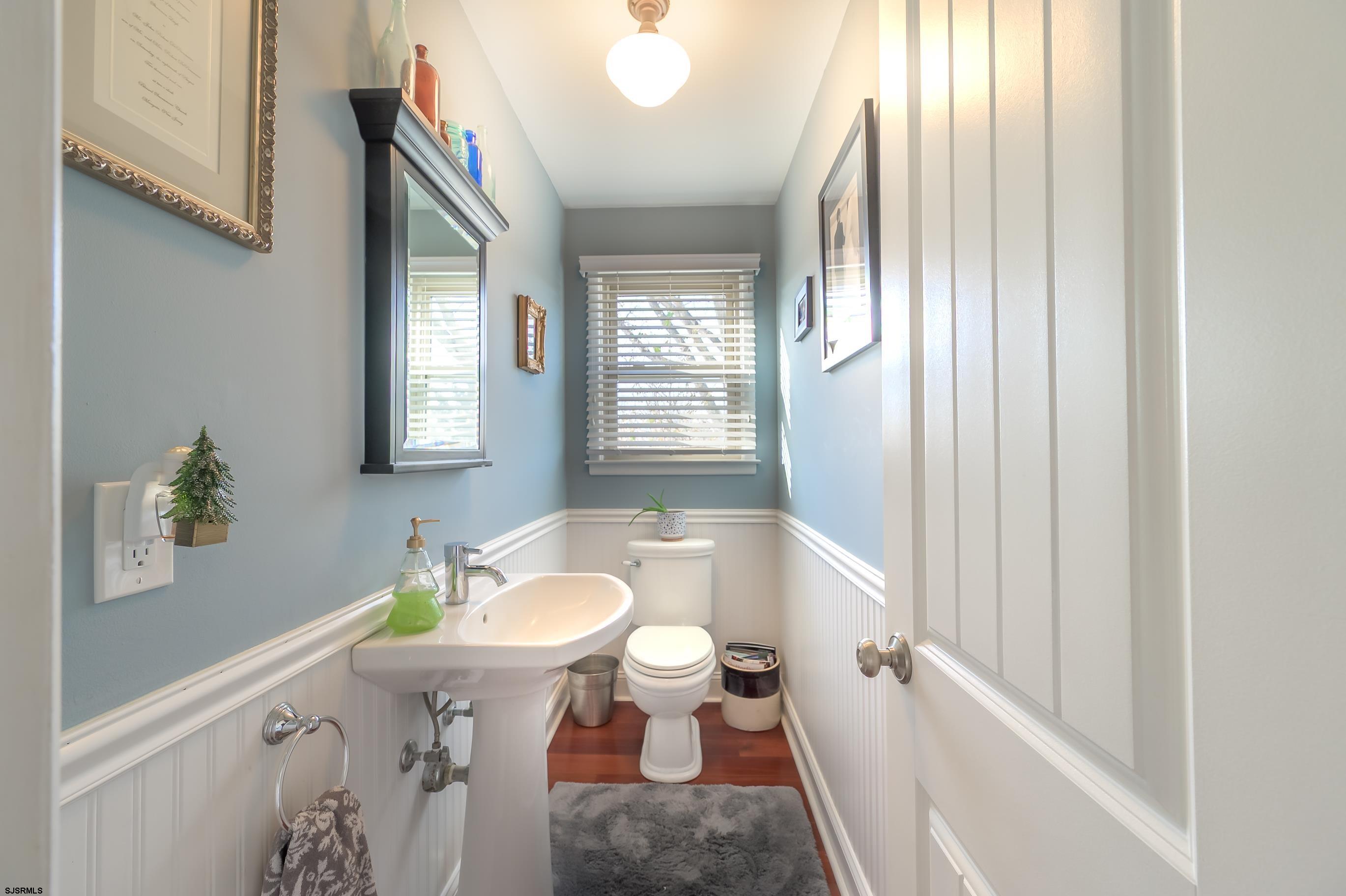 1 Exeter Court Margate City, NJ 08402 - Photo 20 of 25 a bathroom with a sink a toilet and tub