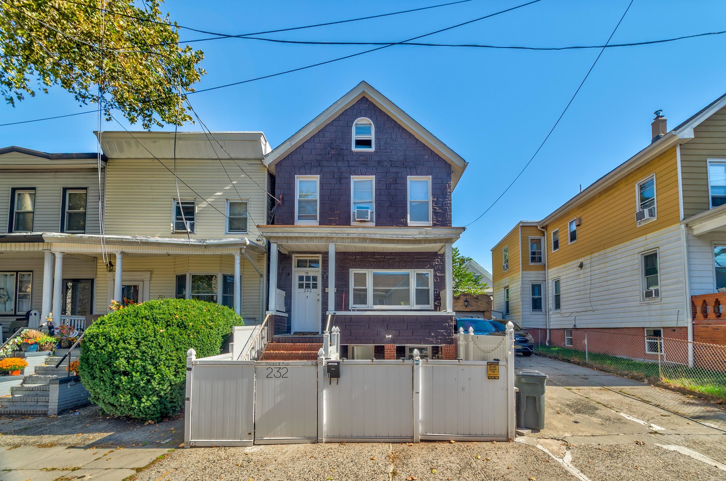 232 Pearsall Avenue, Unit 1 Jersey City, NJ 07305 - Photo 19 of 20 a front view of a house with large windows