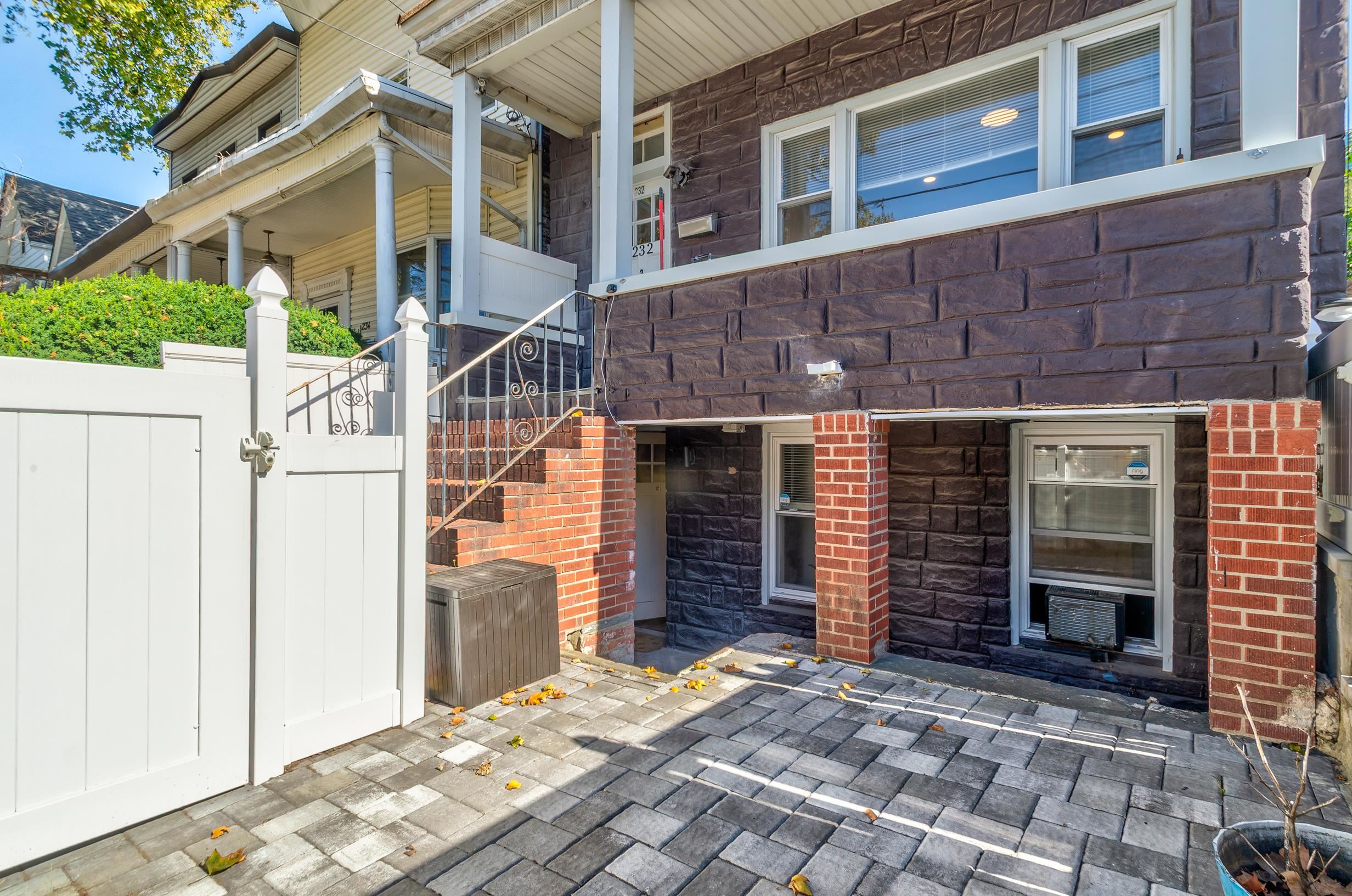232 Pearsall Avenue, Unit 1 Jersey City, NJ 07305 - Photo 2 of 20 a front view of a house with a garage