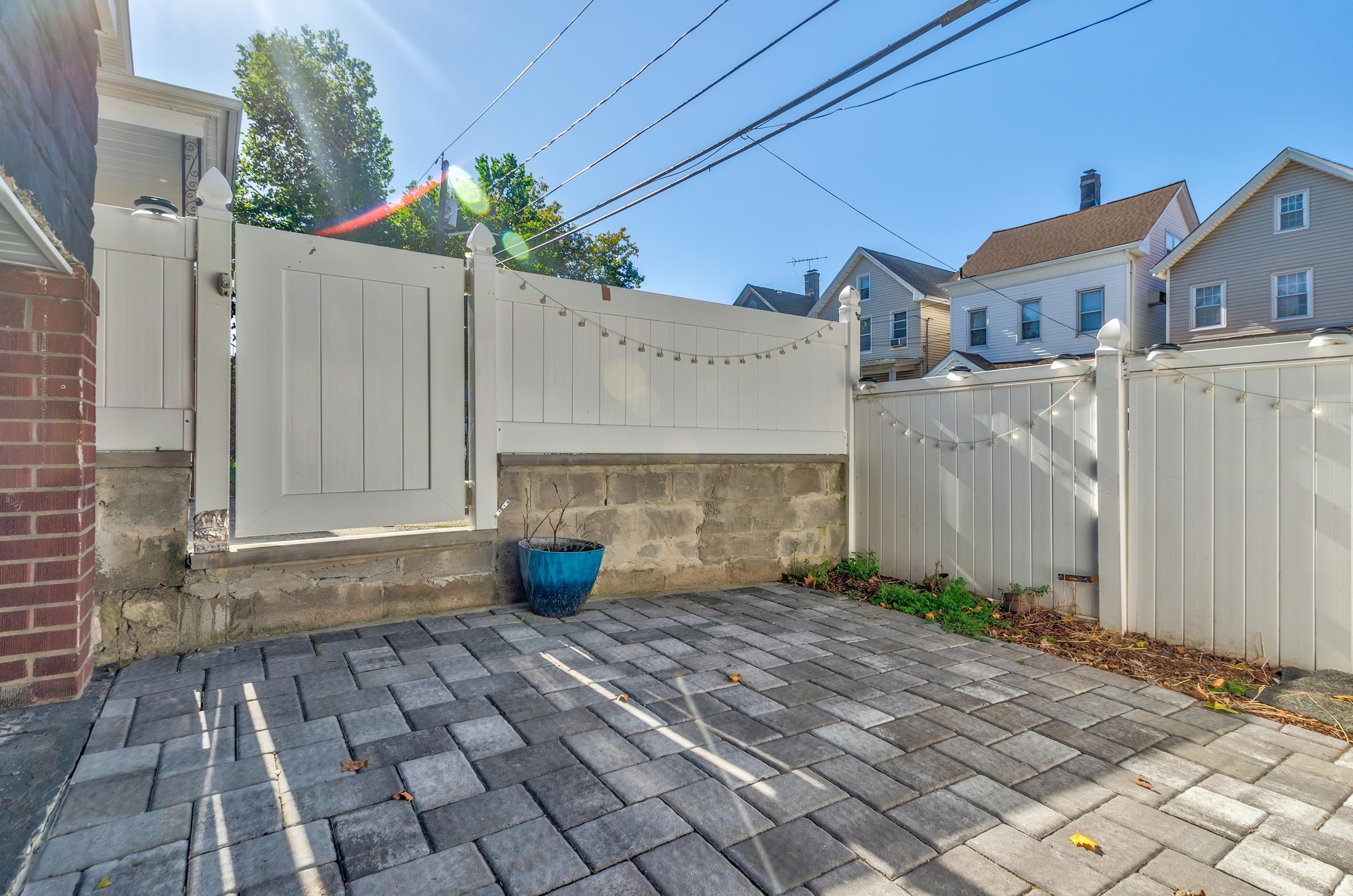 232 Pearsall Avenue, Unit 1 Jersey City, NJ 07305 - Photo 3 of 20 a front view of a house with a yard