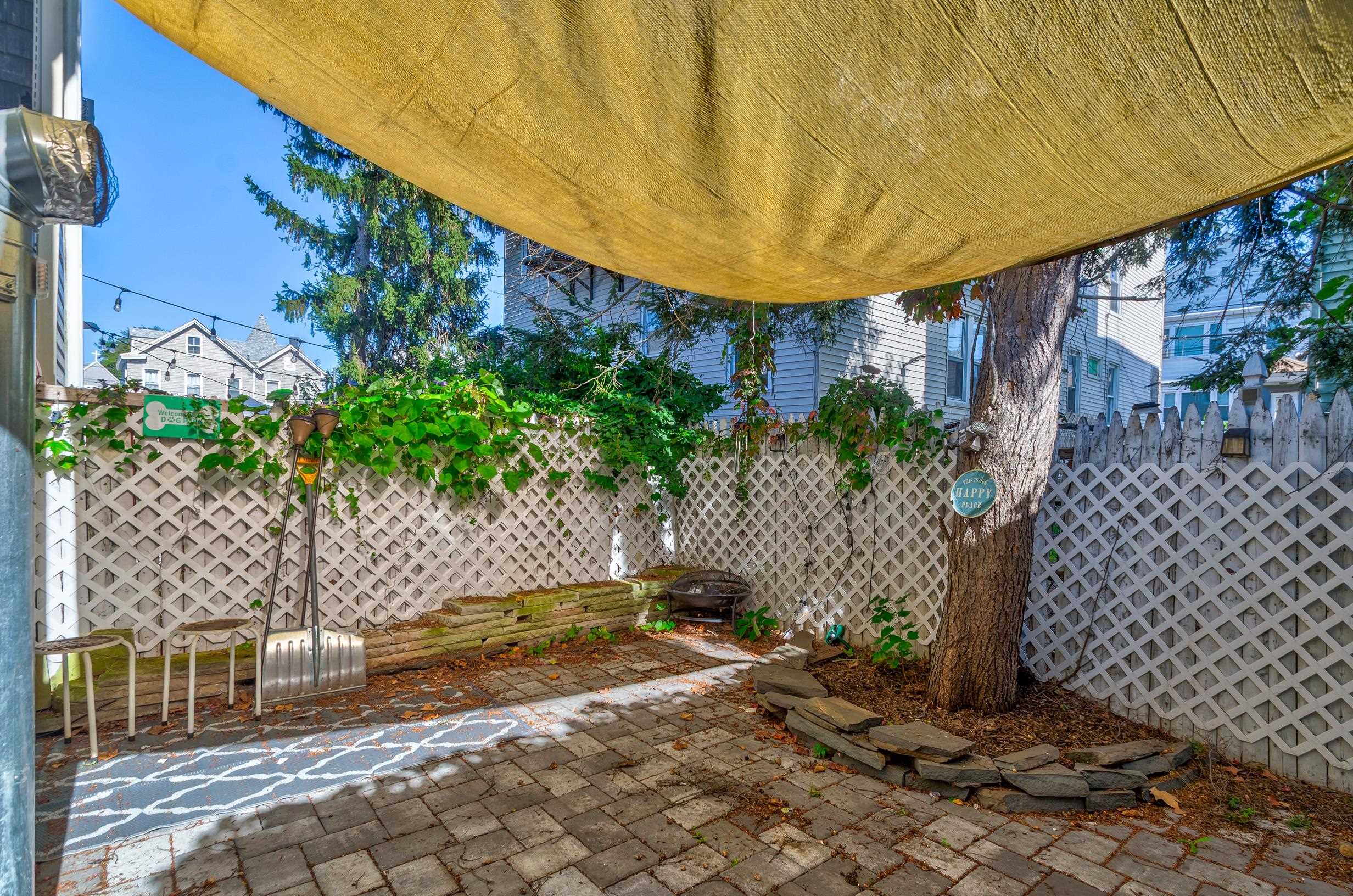 232 Pearsall Avenue, Unit 1 Jersey City, NJ 07305 - Photo 4 of 20 a view of a chairs and table in the patio