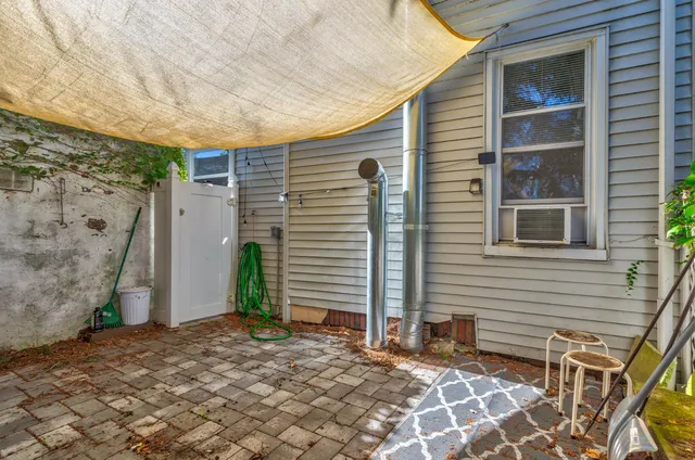 a backyard of a house with seating space