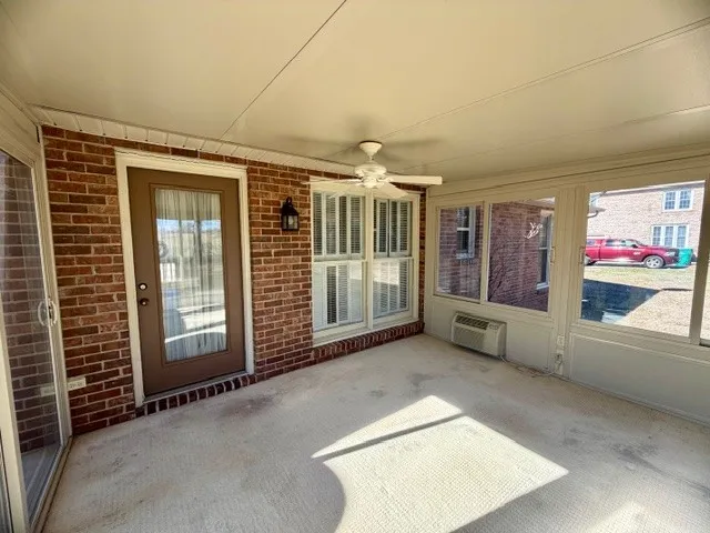 a view of a hallway with a large window
