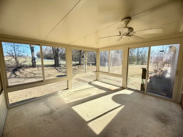 a view of a room with a large window