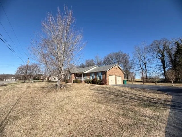 a front view of a building with a yard