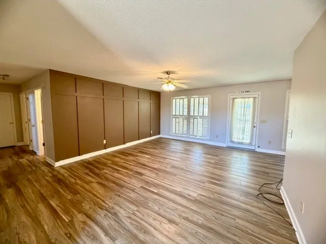 a view of a livingroom with wooden floor
