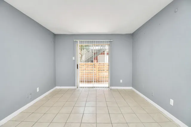 a view of balcony with small yard