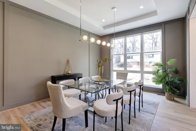 a view of a dining room with furniture window and outside view