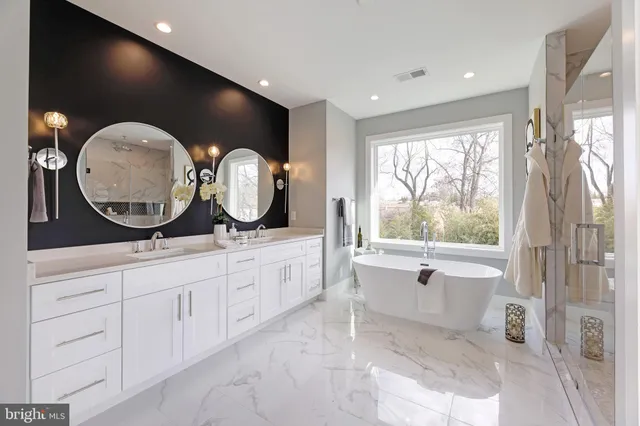 a bathroom with a double vanity sink and a mirror
