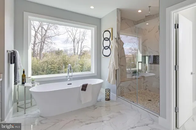 a bathroom with a bathtub and a shower