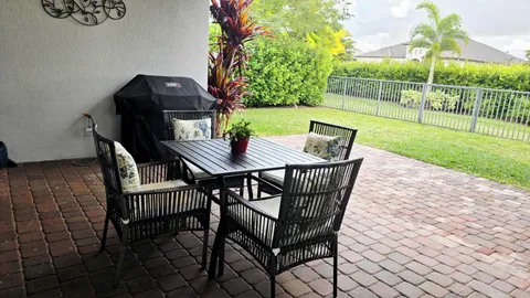 a view of an outdoor sitting area with furniture