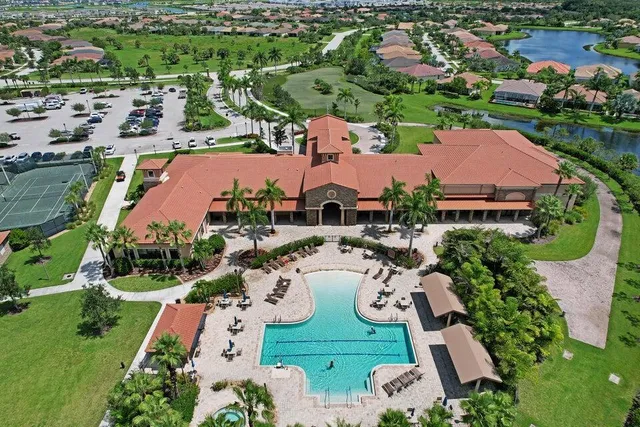 an aerial view of a house with garden space and lake view