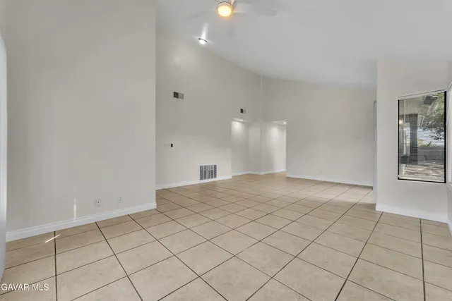 a view of an empty room and window