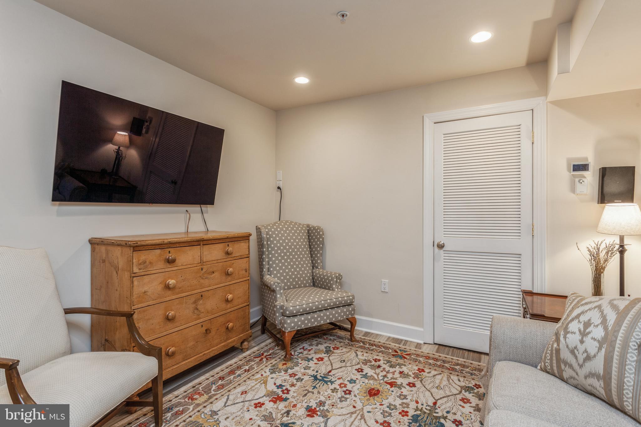 304 Q Street Northwest, Unit 1 Washington, DC 20001 - Photo 12 of 36 a living room with furniture and a flat screen tv