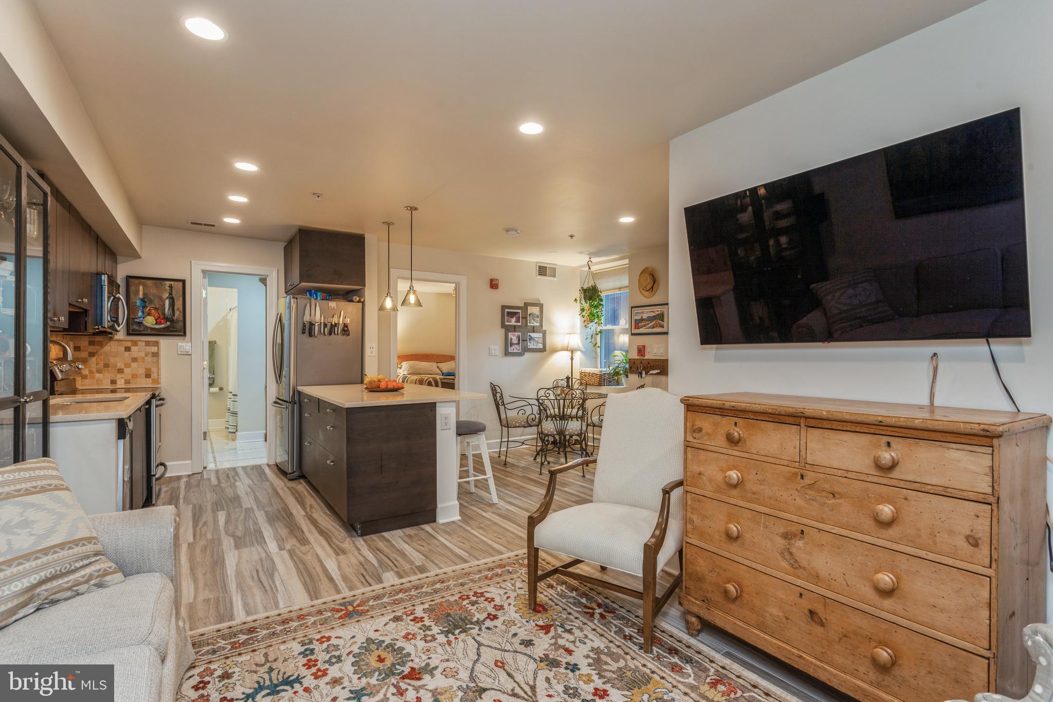 304 Q Street Northwest, Unit 1 Washington, DC 20001 - Photo 32 of 36 a living room with furniture and a flat screen tv