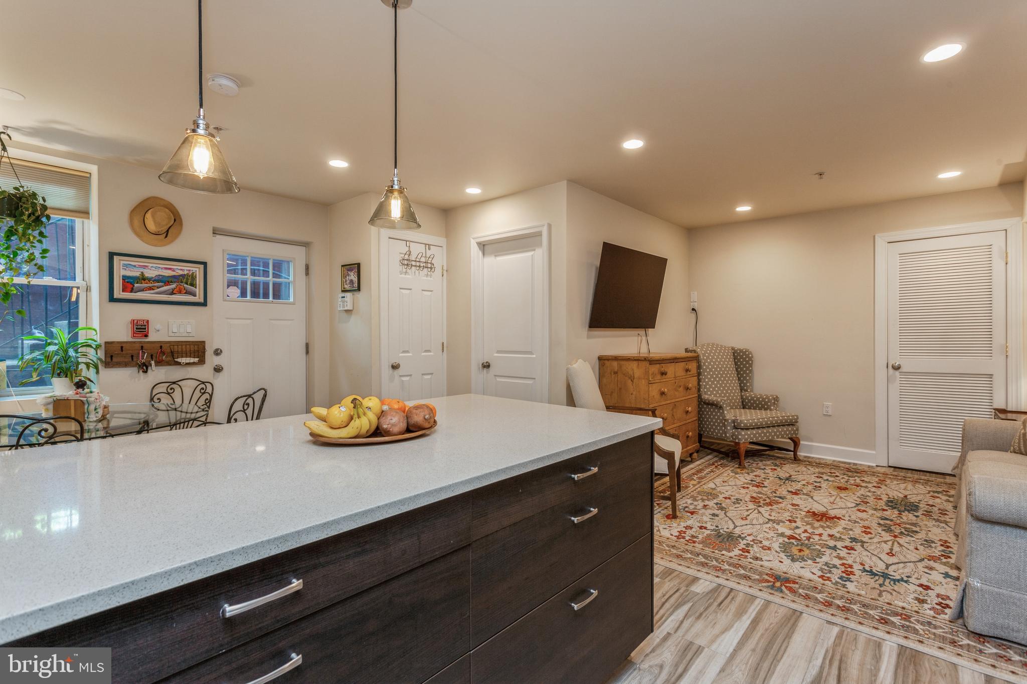 304 Q Street Northwest, Unit 1 Washington, DC 20001 - Photo 8 of 36 a view of a kitchen with kitchen island and stainless steel appliances