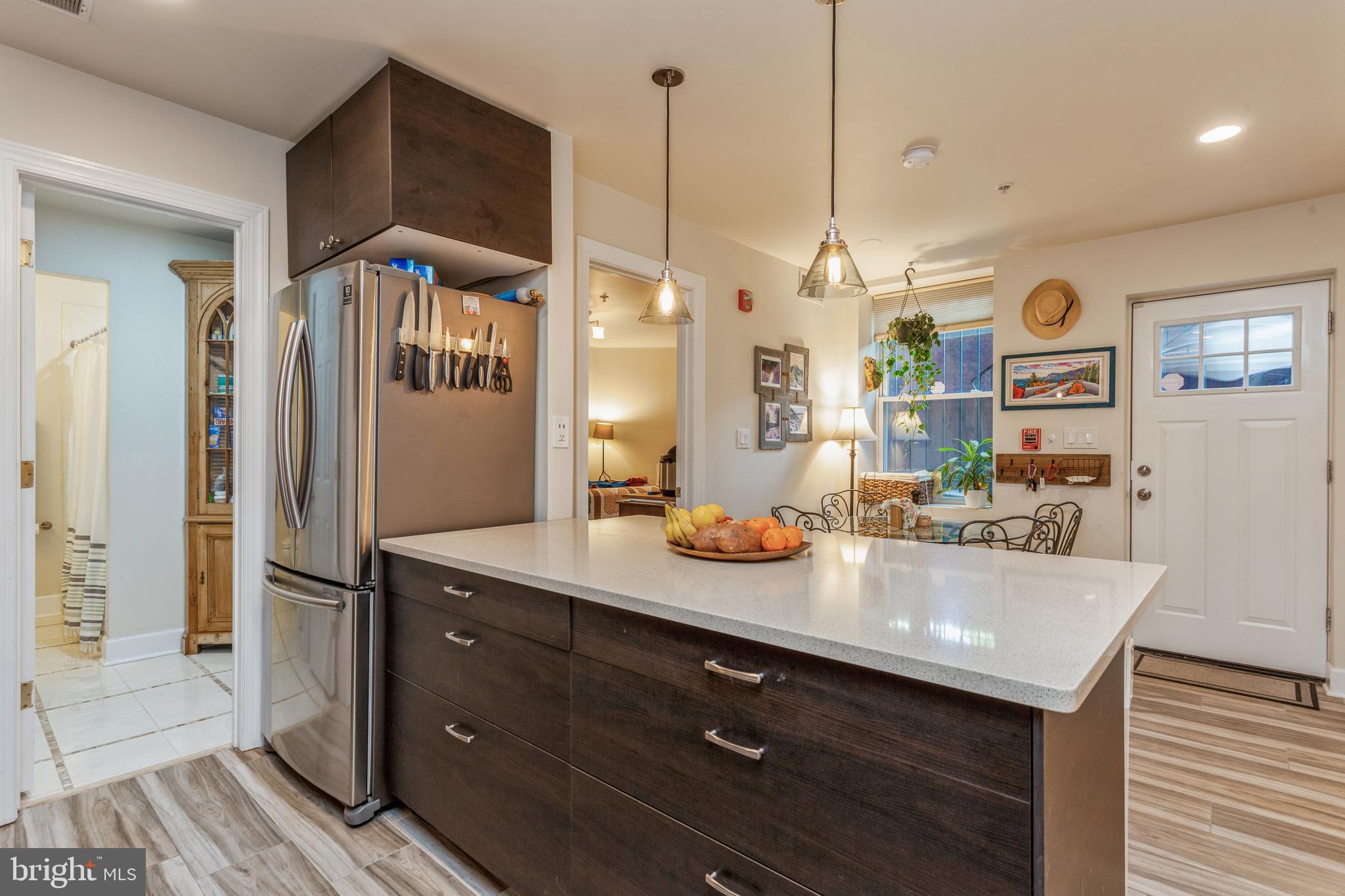 304 Q Street Northwest, Unit 1 Washington, DC 20001 - Photo 9 of 36 a kitchen with sink refrigerator and microwave