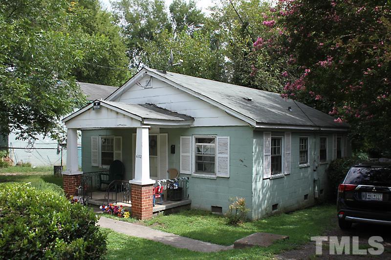 602 Bragg Street Raleigh, NC 27610 - Photo 2 of 3 a front view of a house with yard and green space