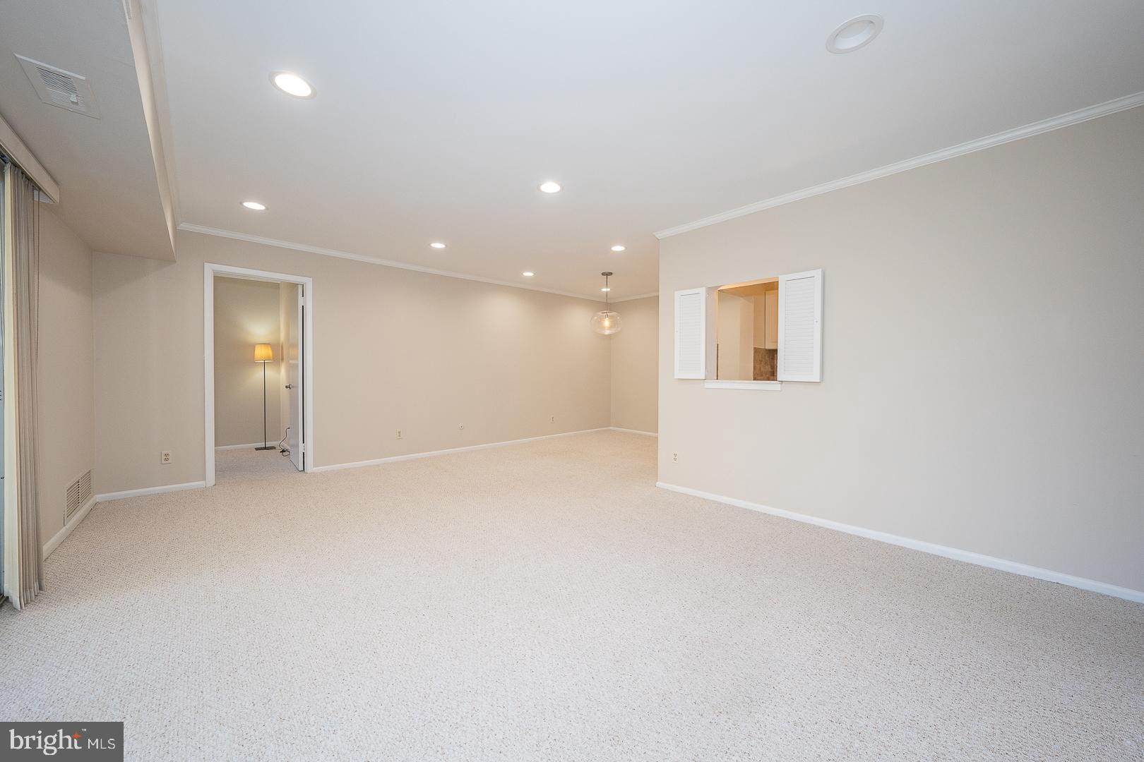 446 Drummers Lane Wayne, PA 19087 - Photo 11 of 29 an empty room with windows and entrance to other room