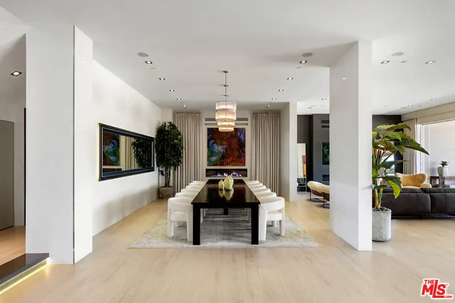 a bedroom with a large bed and a flat screen tv