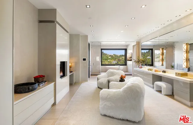 a bedroom with a bed and a fireplace